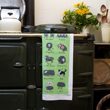 Load image into Gallery viewer, Herdwicks of the Lake District Tea Towel on an AGA
